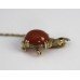 Gold Rhino Form Brooch with Carnelian & Ruby Eyes